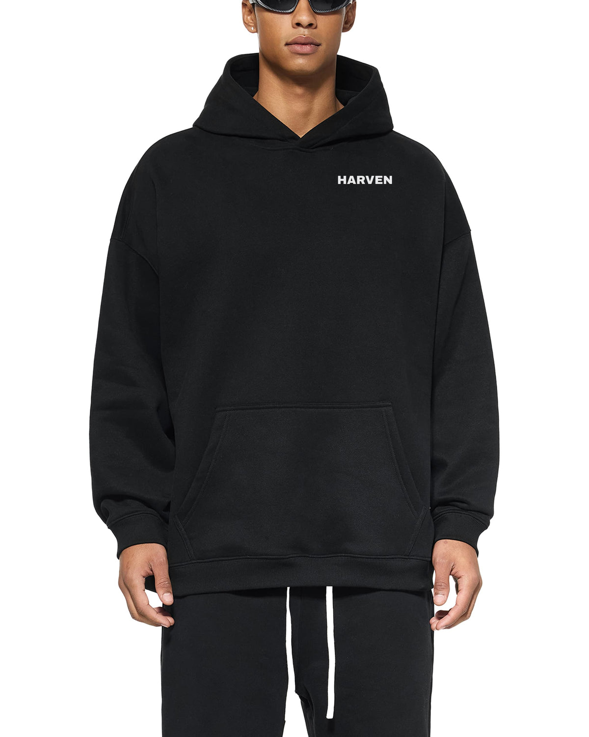 Harven Essential Hoodie in black, worn by model, front – 350 GSM loose fit hoodie