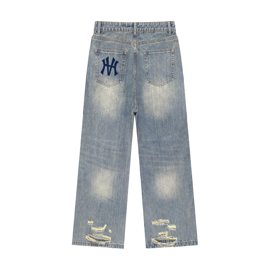 Blue denim jeans with a logo on the pocket against a white background